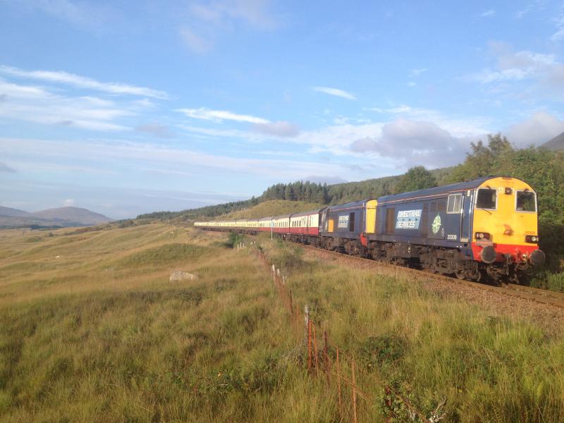 Photo of 20's Autumn Highlander arriving at Bridge of Orchy