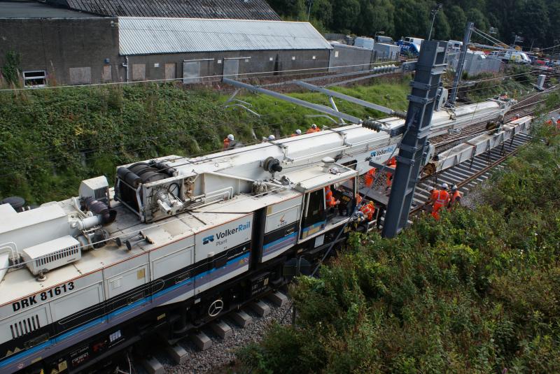 Photo of The second pre-assembled track panel beyond the bridge is placed at Dunblane South Crossover.